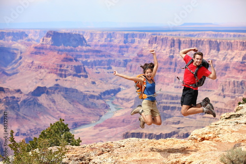 Photo: Happy people jumping in Grand Canyon Happy people jumping in Grand Canyon