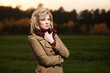 Young woman walking in autumn field