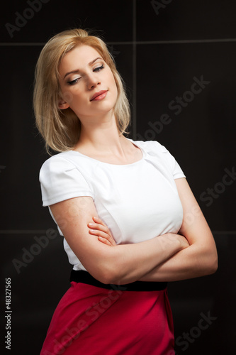 Photo: Sad young woman looking down Sad young woman looking down