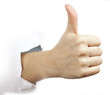 Hand with thumb up through a hole in paper