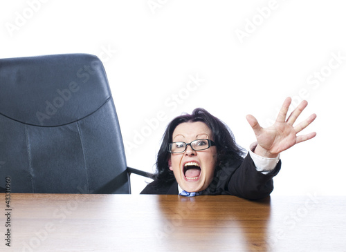 Photo: anxious woman asking for help from her desk anxious woman asking for help from her desk