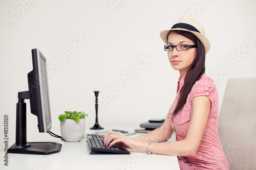 Photo: Portrait of a pretty female student tipping Portrait of a pretty female student tipping