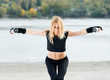 Beautiful fit woman exercising on the beach