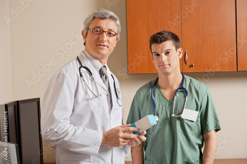 Photo: Doctor Holding Medicine Box Doctor Holding Medicine Box