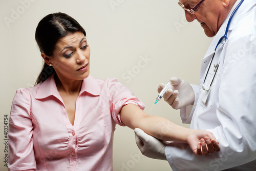 Photo: Woman Having Blood Test Woman Having Blood Test