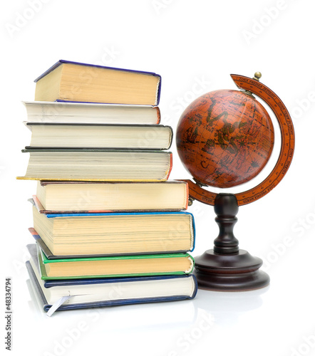Photo: books and vintage globe on white background books and vintage globe on white background