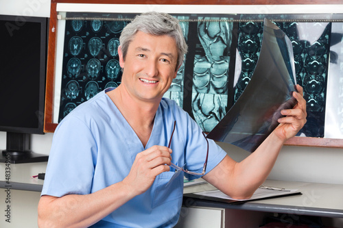 Photo: Happy Radiologist Holding X-ray Happy Radiologist Holding X-ray