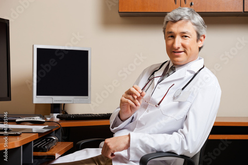 Photo: Male Doctor In Clinic Male Doctor In Clinic