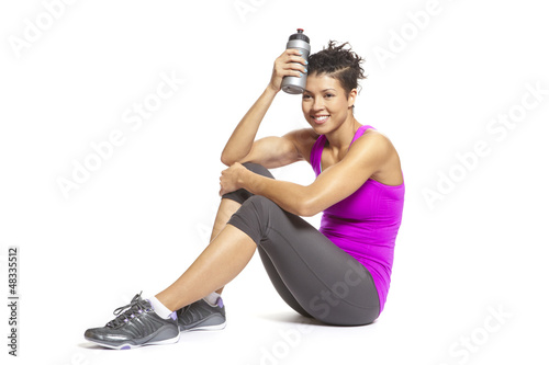Photo: Young woman relaxing in sports outfit Young woman relaxing in sports outfit