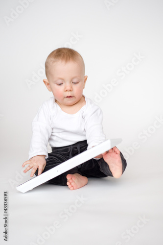 Photo: Baby with computer keyboard Baby with computer keyboard