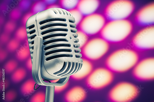 Photo: retro microphone on purple disco background retro microphone on purple disco background