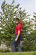 young man pointing showing a direction outdoors