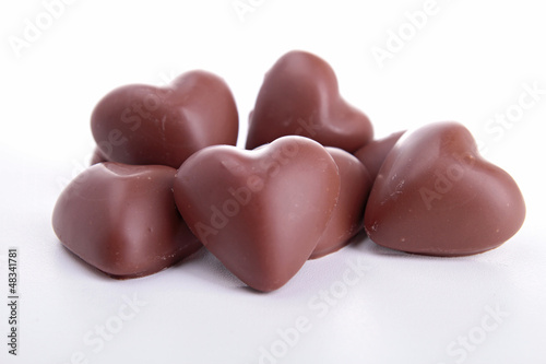 Photo: heart shape chocolate isolated on white heart shape chocolate isolated on white