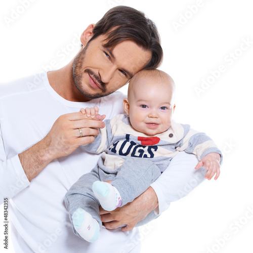 Photo: Proud young father posing with his baby Proud young father posing with his baby