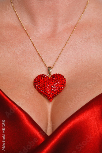 Photo: Heart necklace and red satin dress Heart necklace and red satin dress
