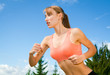 young woman playing sports, jogging outdoors, recreation, backgr