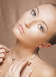 Beauty Woman Face. Elegant Golden Necklace with Pearls