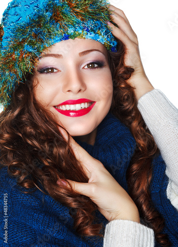 Photo: Happy Smiling Brunette wearing Knitted Blue Cap and Jersey Happy Smiling Brunette wearing Knitted Blue Cap and Jersey