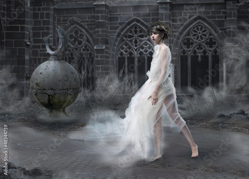 Photo: Mystery. Woman Silhouette in Old Smoky Castle. Ancient Scenic Mystery. Woman Silhouette in Old Smoky Castle. Ancient Scenic