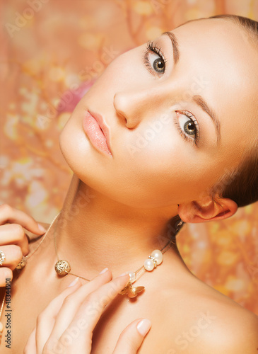 Photo: Tenderness. Portrait of Imposing Woman with Gold Pearly Chainlet Tenderness. Portrait of Imposing Woman with Gold Pearly Chainlet