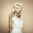 Photo: Portrait of a beautiful blonde woman with flowers in her hair Portrait of a beautiful blonde woman with flowers in her hair