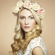 Photo: Portrait of a beautiful blonde woman with flowers in her hair Portrait of a beautiful blonde woman with flowers in her hair