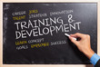 man writing the  training and development  concepts