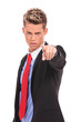 serious businessman pointing accusing finger