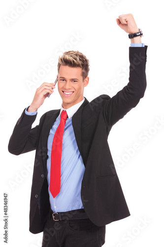 Photo: man discussing on a cell phone and winning man discussing on a cell phone and winning
