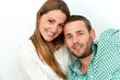 Portrait of handsome couple with heads together.