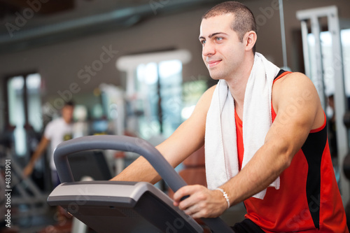 Photo: Man training in a fitness club Man training in a fitness club