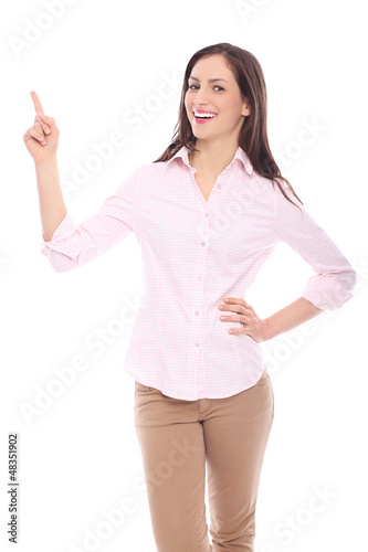 Photo: Smiling woman pointing up Smiling woman pointing up