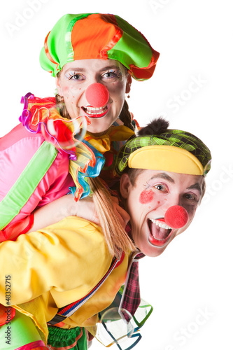 Photo: Two smiling clowns isolated over a white background Two smiling clowns isolated over a white background