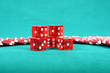Poker gambling chips on a green playing table