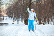 Happy woman on cross ski riding on snow with copyspace