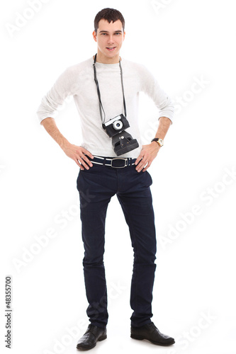 Photo: Young handsome photographer in studio Young handsome photographer in studio