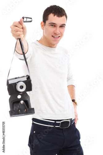 Photo: Young handsome photographer in studio Young handsome photographer in studio