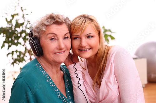 Photo: Happy elderly woman with granddaughter Happy elderly woman with granddaughter