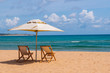 Beach Chairs and Umbrella on a Tropical beach