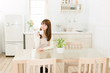 Beautiful asian woman in the kitchen