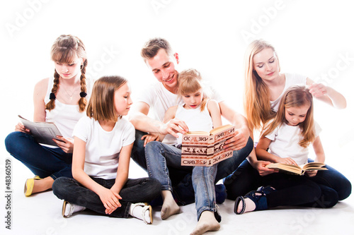 Photo: Happy family of parents and young children Happy family of parents and young children