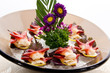 An assortment of different types of sashimi served on a delicate