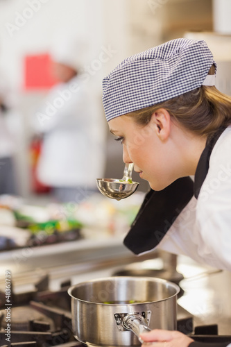 Photo: Chef smelling her soup Chef smelling her soup