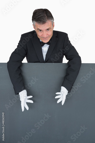 Photo: Waiter showing the grey board Waiter showing the grey board