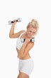 Photo: Young woman exercising with dumbbells Young woman exercising with dumbbells