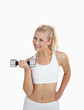 Photo: Portrait of young woman exercising with dumbbell Portrait of young woman exercising with dumbbell