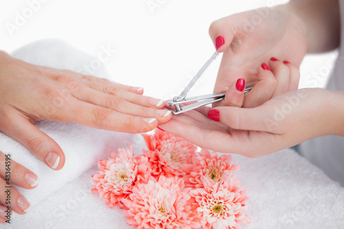 Photo: Woman cutting fingernail Woman cutting fingernail