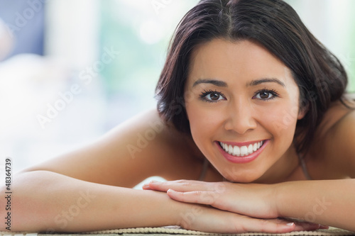 Photo: Attractive woman lying by the pool Attractive woman lying by the pool