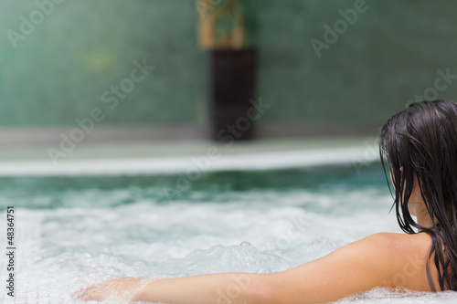 Photo: Woman relaxing in jacuzzi Woman relaxing in jacuzzi