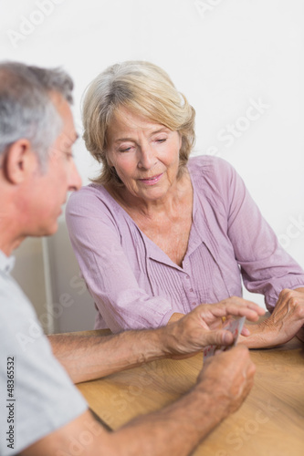 Photo: Husband and wife playing cards Husband and wife playing cards